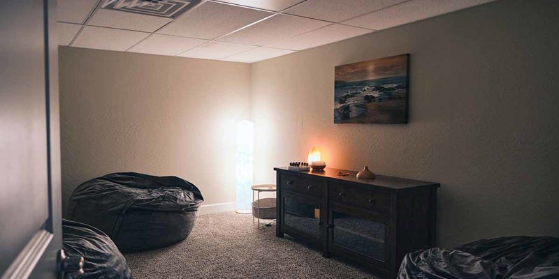 A peaceful relaxation room with soft lighting, cozy bean bags, and calming decor, perfect for unwinding and practicing mindfulness.