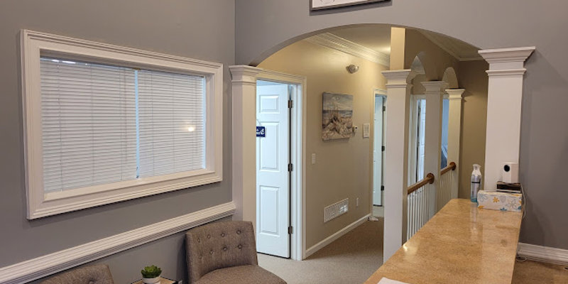 A cozy, well-lit reception area featuring comfortable seating, soft gray walls, and a sign above that reads "Hope changes everything."