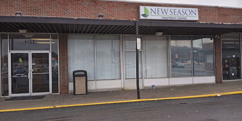  Front view of a brick building housing a treatment center, featuring large windows and a clear, welcoming sign above the entrance.