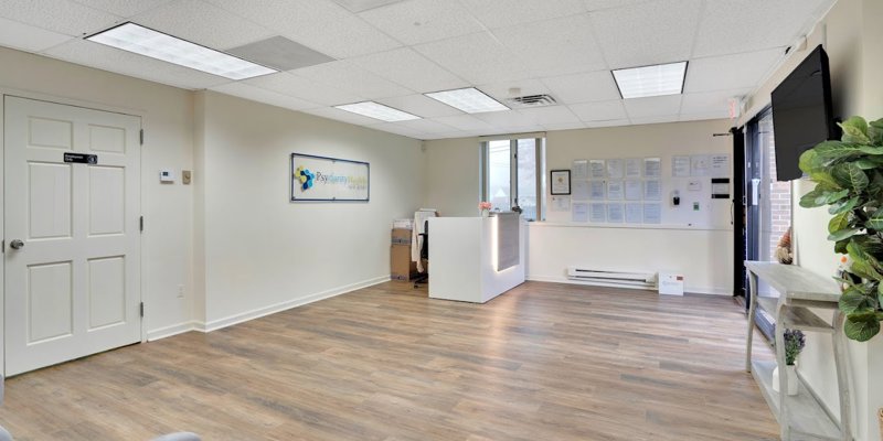 A welcoming lobby with a reception desk and light decor, perfect for greeting visitors and clients with a warm, inviting atmosphere.