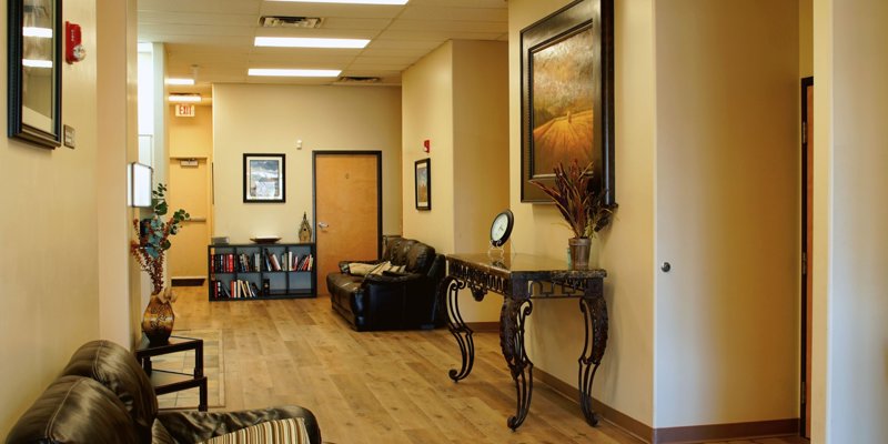  A warm, inviting hallway with comfortable seating, stylish decor, and a cozy reading nook, creating a relaxed and welcoming atmosphere.